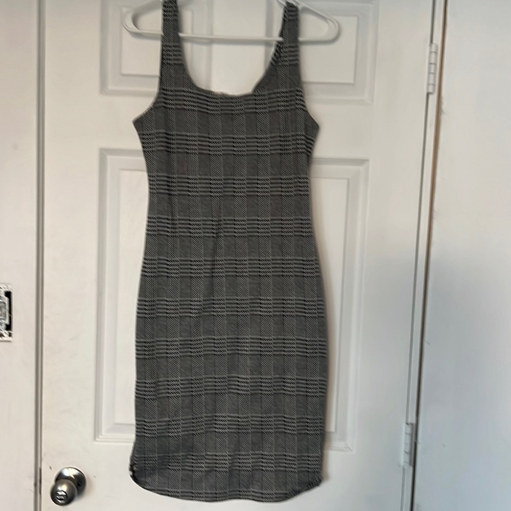Black and white dress with red and white stripes on the side